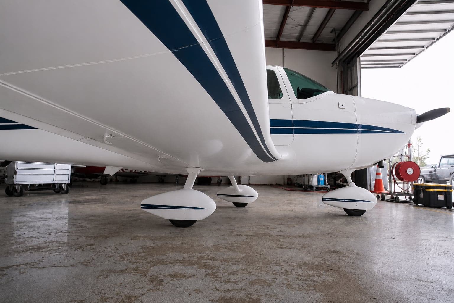 The same aircraft's underside cleaned to a bright, spotless finish